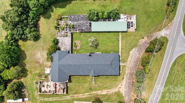an aerial view of a house with a swimming pool