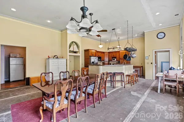 a view of a dining area with furniture and chandelier