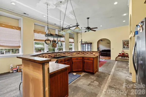 a kitchen with stainless steel appliances granite countertop a stove and a sink