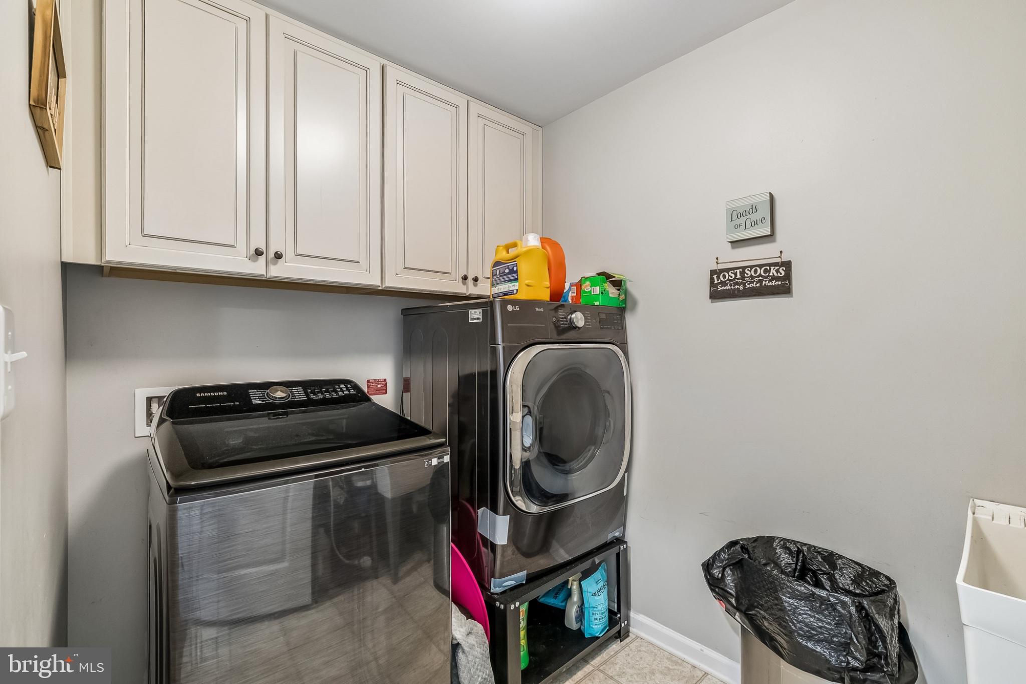 14081 Carriage Ford Road Nokesville, VA 20181 - Photo 17 of 38 Modern laundry space with ample storage.
