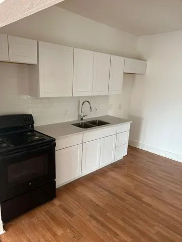a kitchen with a sink and cabinets