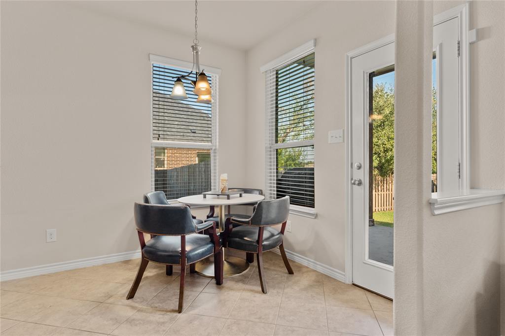 5533 Wisdom Court Waco, TX 76708 - Photo 11 of 21 a view of a dining room with furniture window and wooden floor