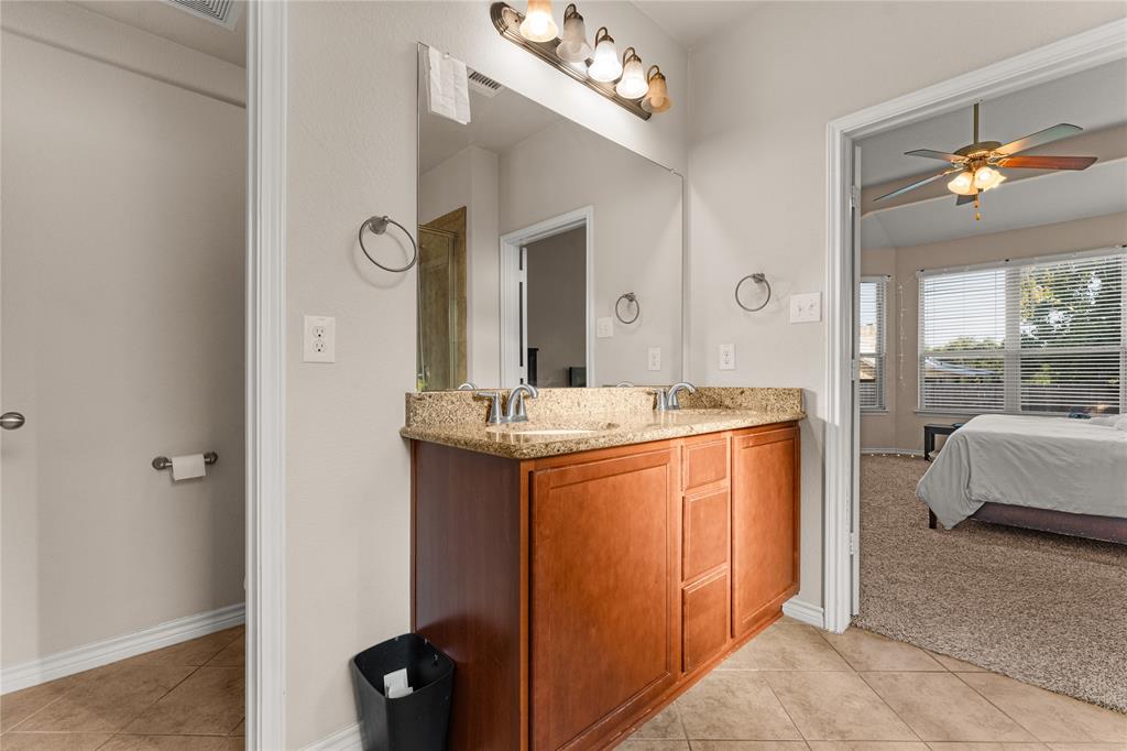 5533 Wisdom Court Waco, TX 76708 - Photo 5 of 21 a bathroom with a sink vanity and a mirror