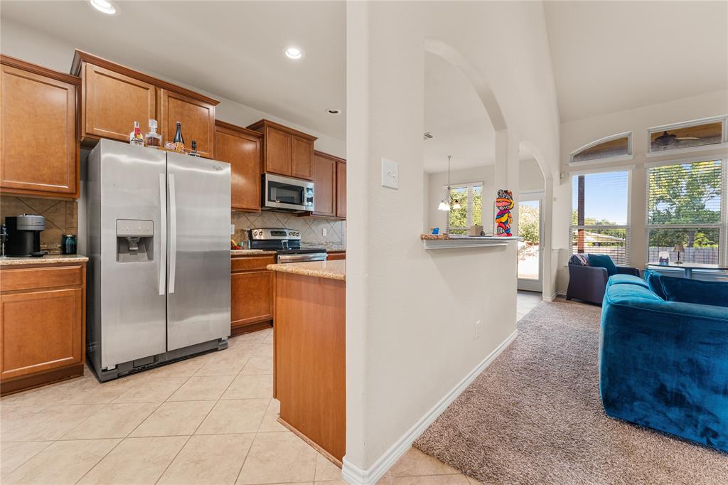 5533 Wisdom Court Waco, TX 76708 - Photo 8 of 21 a kitchen with stainless steel appliances granite countertop a refrigerator and a stove