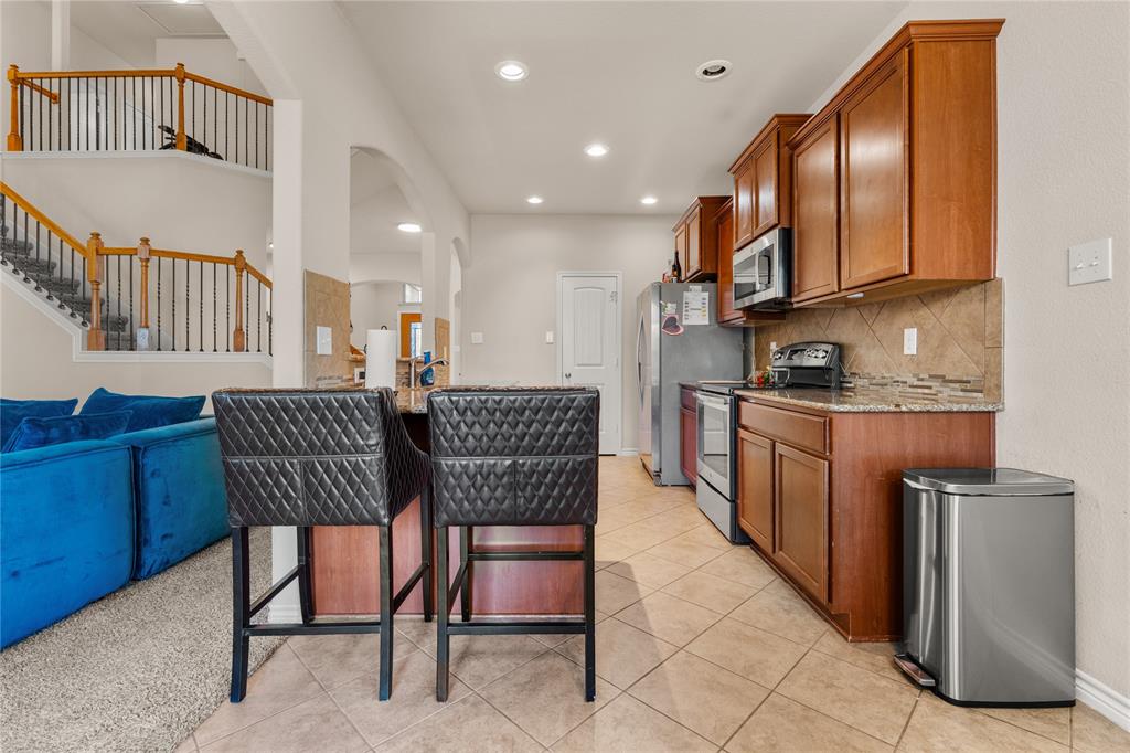 5533 Wisdom Court Waco, TX 76708 - Photo 10 of 21 a dining room with furniture and a chandelier