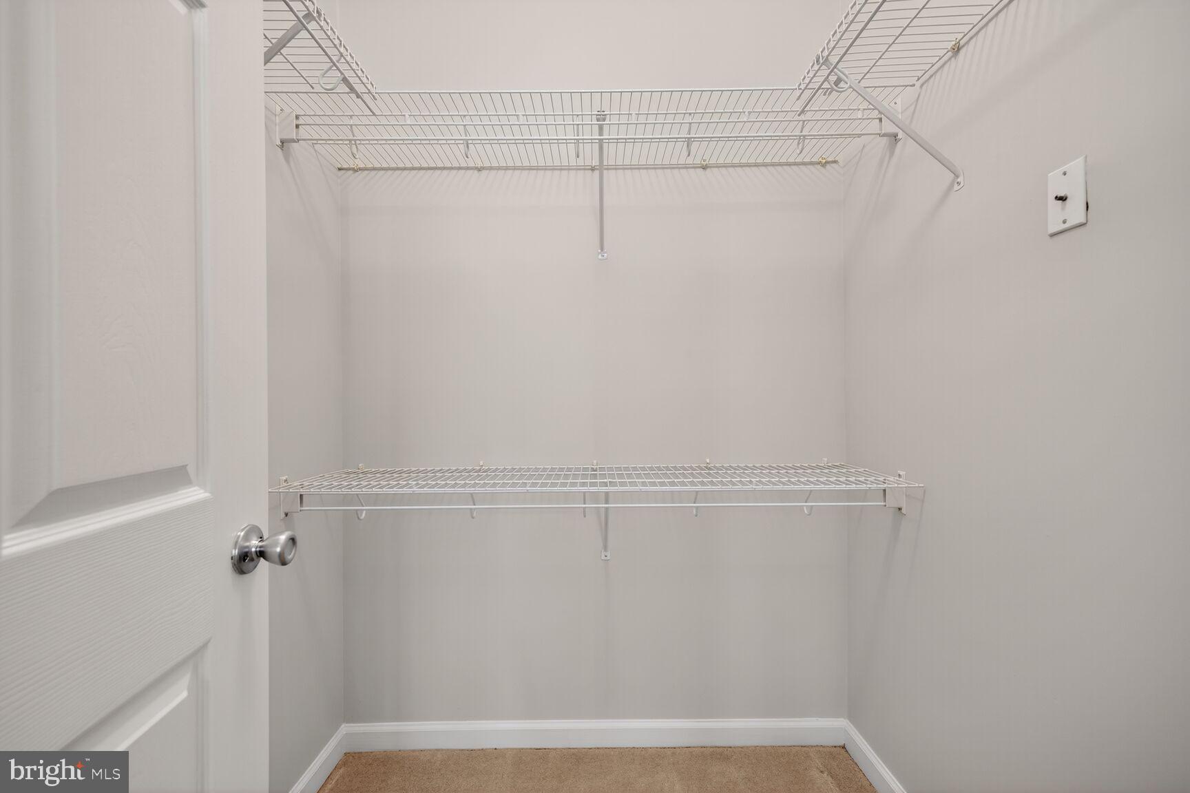 7 Granite Place, Unit 215 Gaithersburg, MD 20878 - Photo 20 of 36 a view of a room with racks on the wall