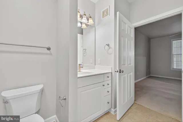 a bathroom with a toilet sink and shower