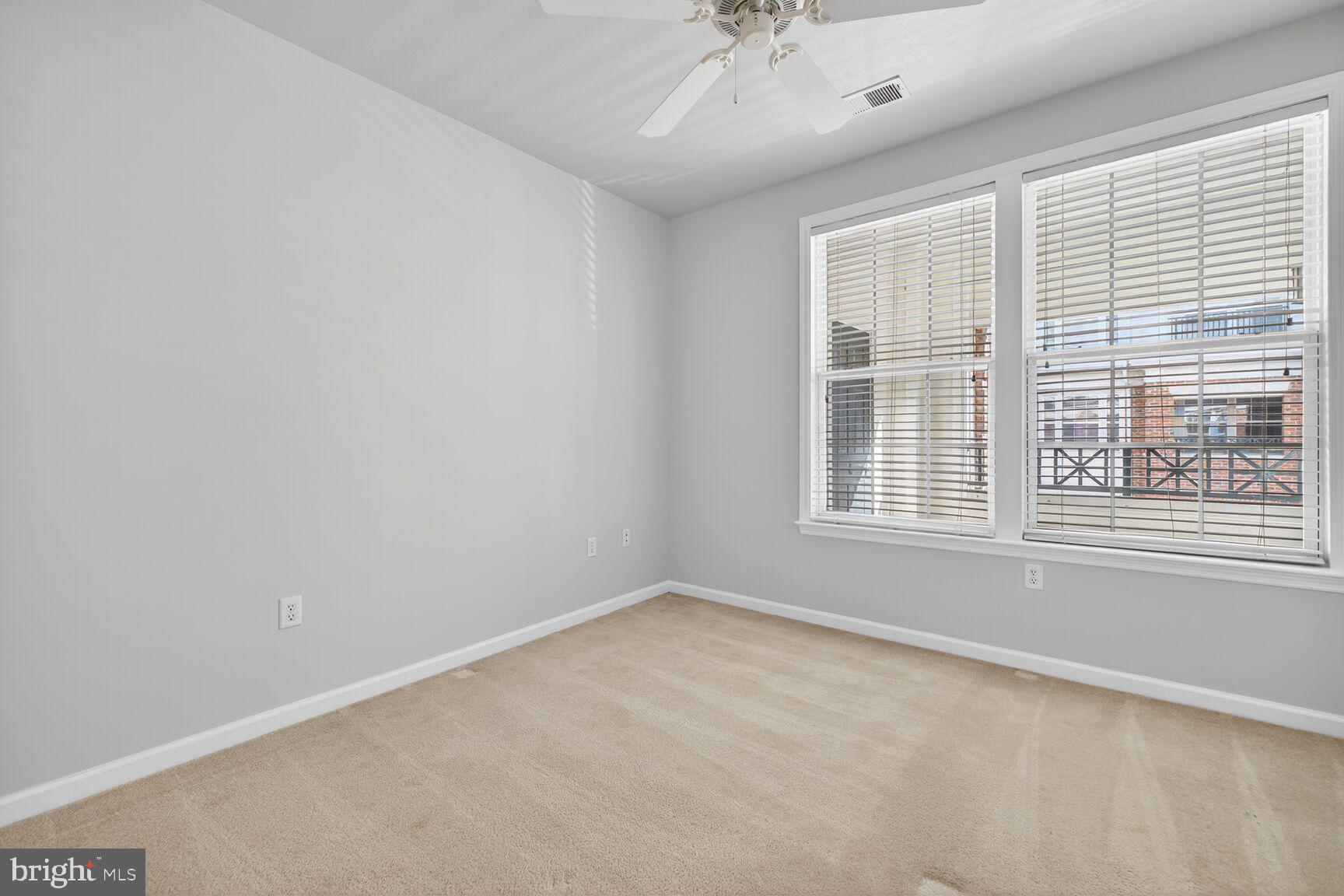 7 Granite Place, Unit 215 Gaithersburg, MD 20878 - Photo 26 of 36 an empty room with a window