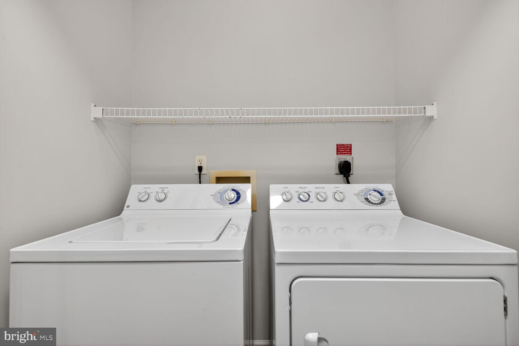 7 Granite Place, Unit 215 Gaithersburg, MD 20878 - Photo 28 of 36 a utility room with dryer and washer