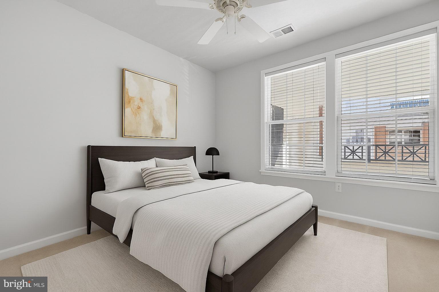 7 Granite Place, Unit 215 Gaithersburg, MD 20878 - Photo 3 of 36 a bedroom with a bed and a window