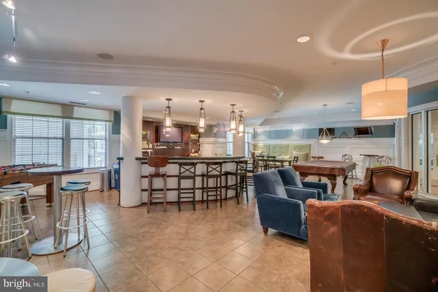 a room with lots of chairs and a table