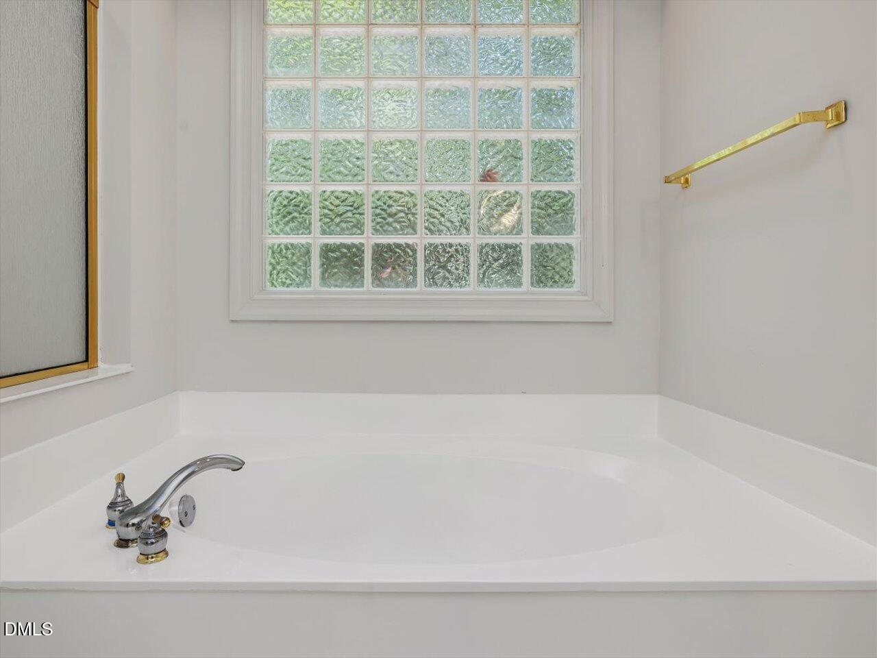 2721 Glassman Lane Raleigh, NC 27606 - Photo 14 of 26 a bathroom with a bathtub