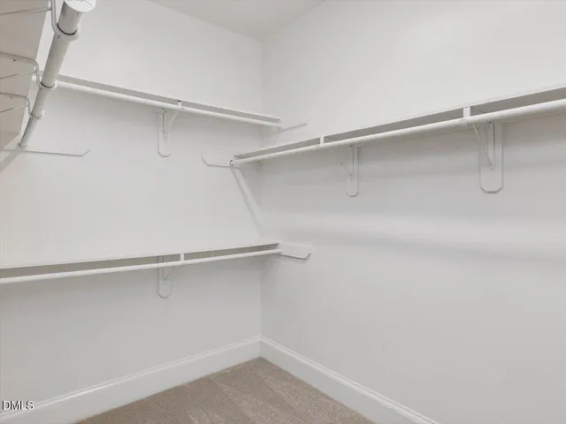 a view of an empty walk in closet