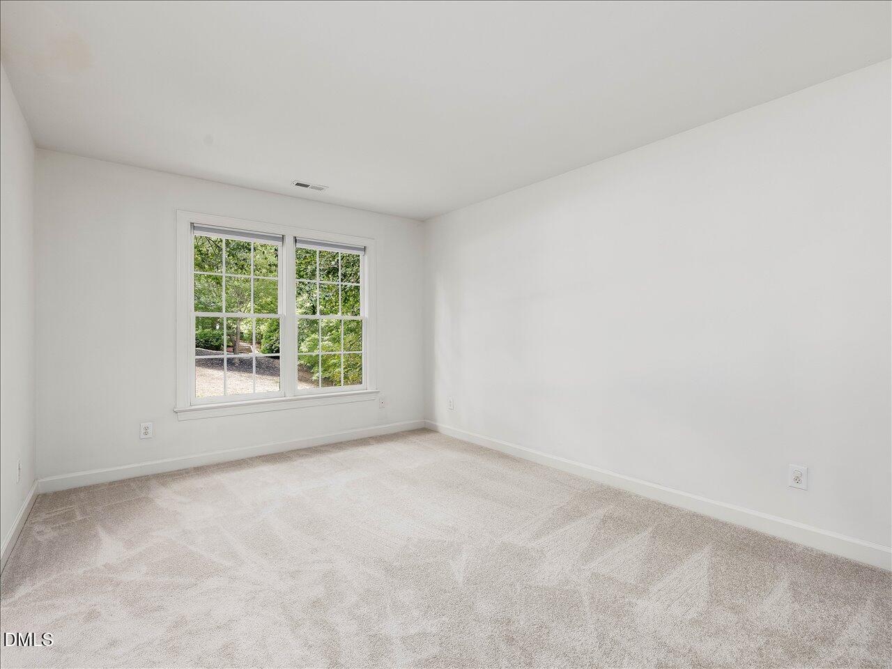 2721 Glassman Lane Raleigh, NC 27606 - Photo 21 of 26 an empty room with windows