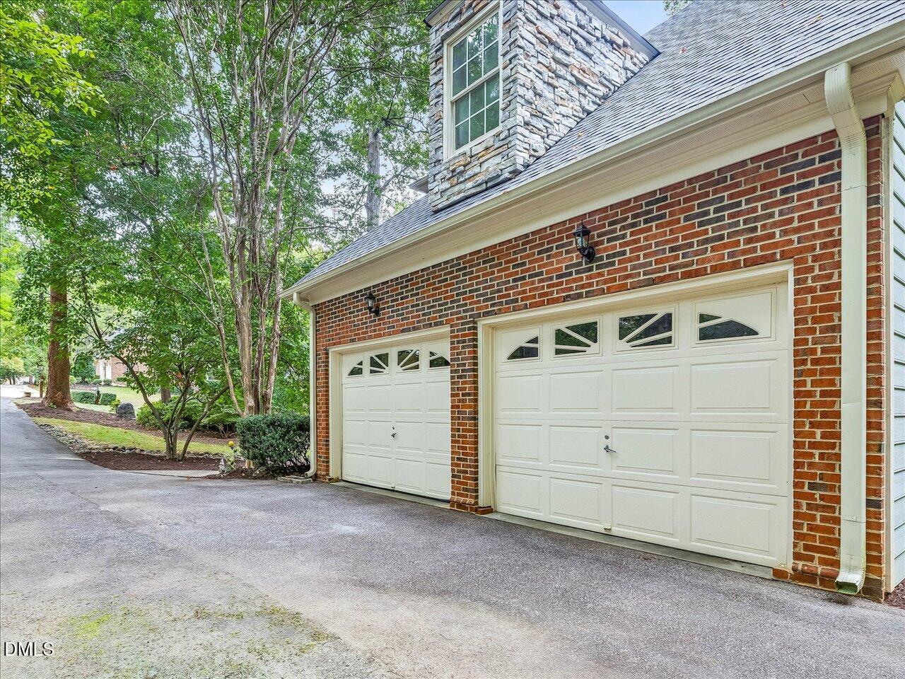 2721 Glassman Lane Raleigh, NC 27606 - Photo 24 of 26 a front view of a house with a yard