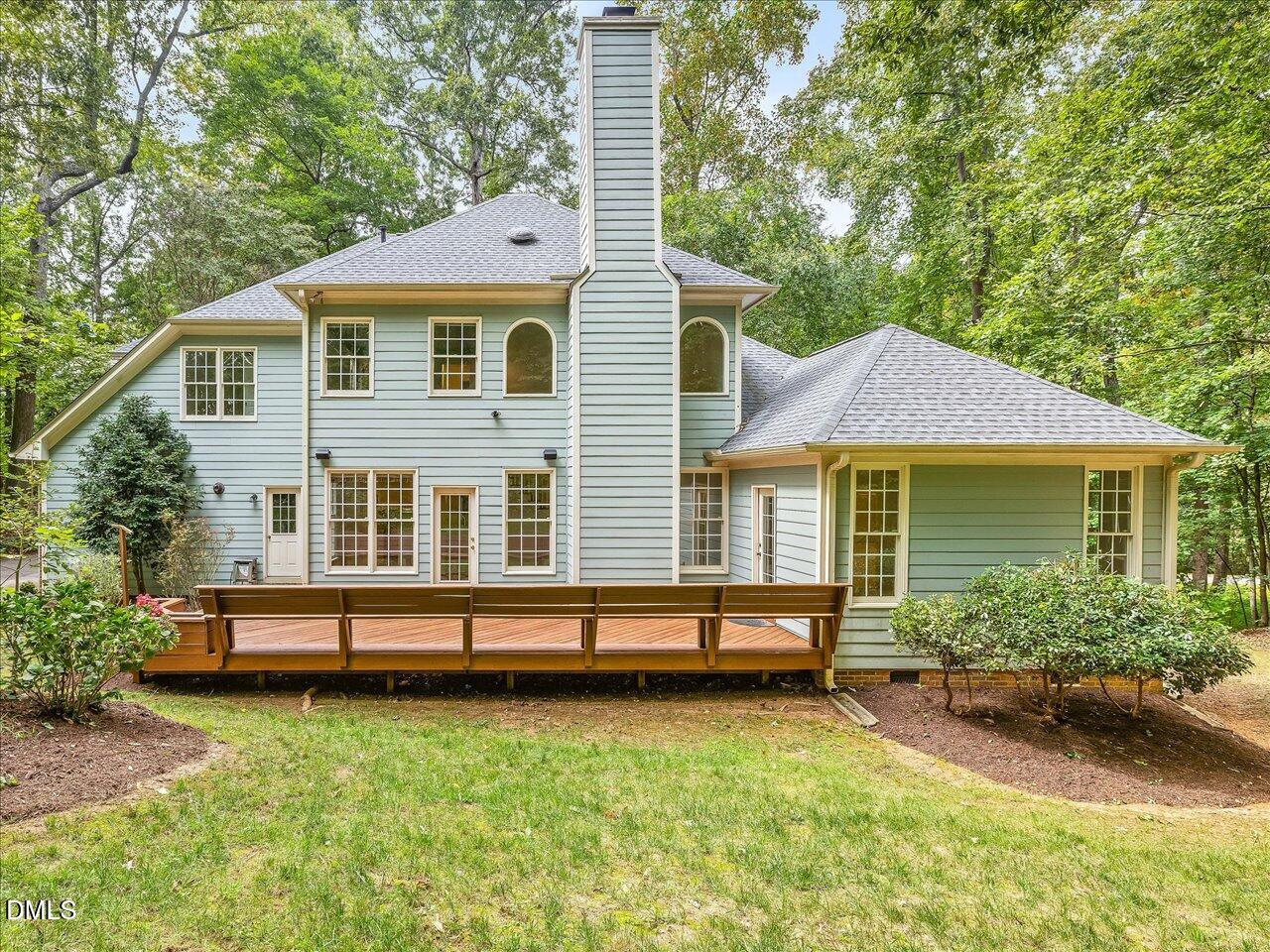 2721 Glassman Lane Raleigh, NC 27606 - Photo 25 of 26 a front view of a house with a yard