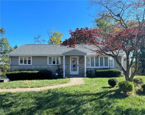 front view of a house with a yard