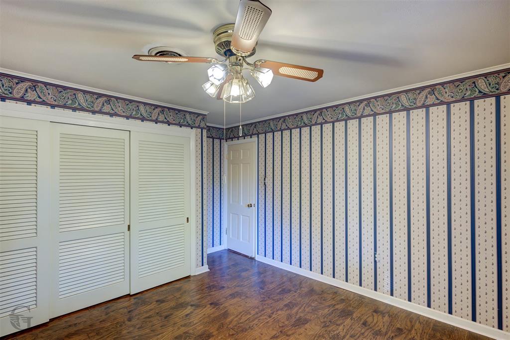 1306 East Todd Street Minden, LA 71055 - Photo 23 of 27 a view of a hallway with a chandelier fan