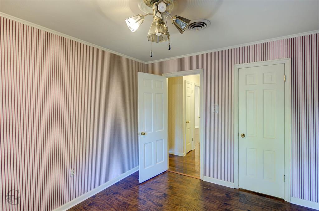 1306 East Todd Street Minden, LA 71055 - Photo 25 of 27 a view of a hallway with wooden floor