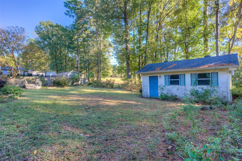 1306 East Todd Street Minden, LA 71055 - Photo 7 of 27 a view of a house with yard and a garden