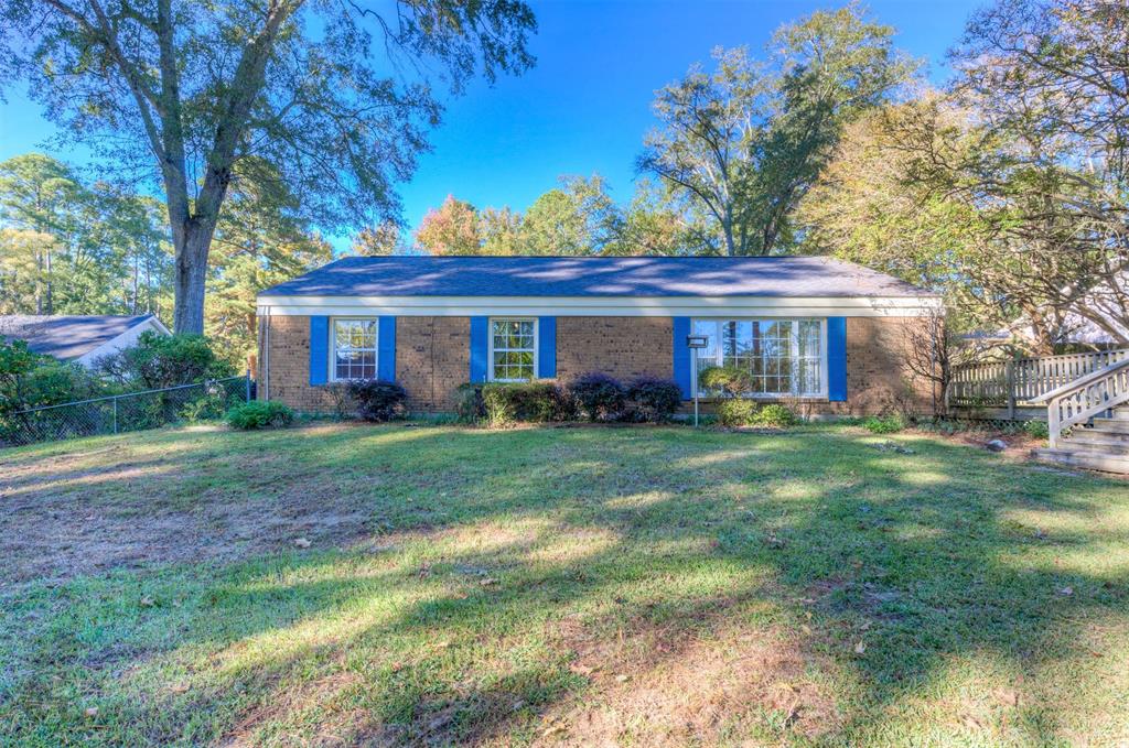 1306 East Todd Street Minden, LA 71055 - Photo 8 of 27 a front view of a house with a yard