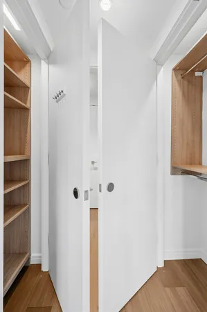 a view of a hallway with washer and dryer