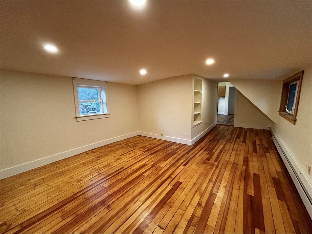 46 Elm Street, Unit 2 Buckland, MA 01370 - Photo 6 of 15 a view of an empty room with wooden floor