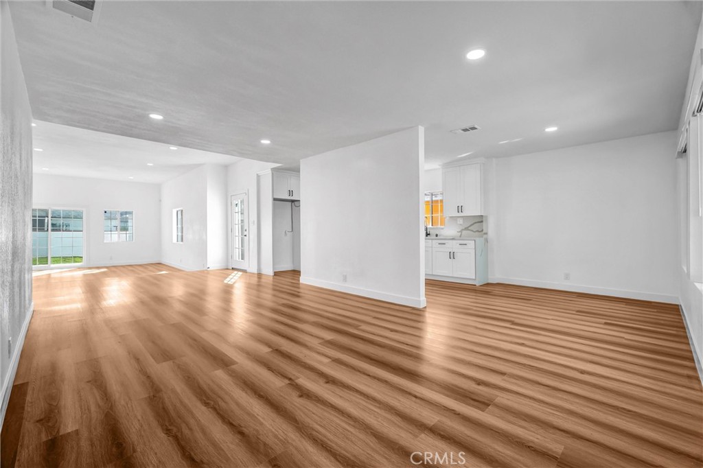 1200 South Castlegate Avenue Compton, CA 90221 - Photo 5 of 39 a view of empty room with wooden floor