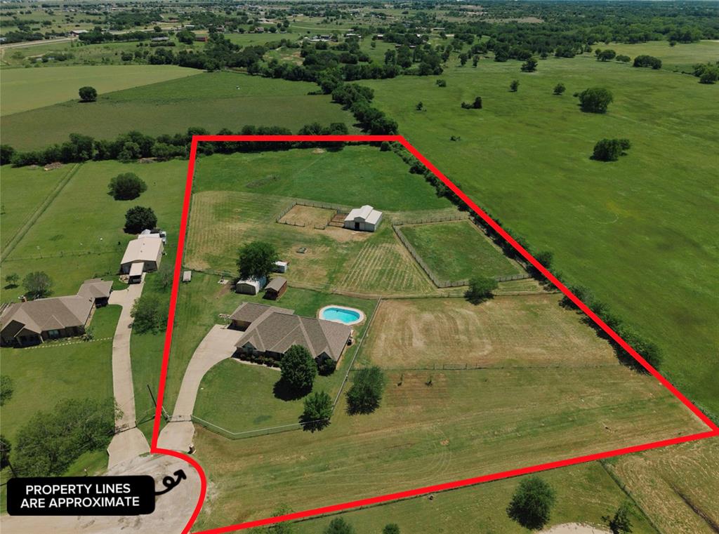 1035 Highland Road Cleburne, TX 76033 - Photo 35 of 36 a view of swimming pool with a yard