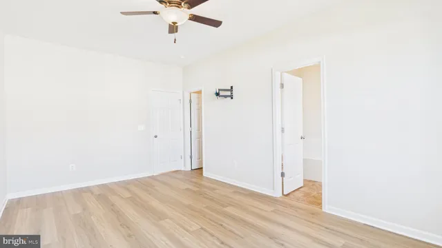 a view of a room with wooden floor
