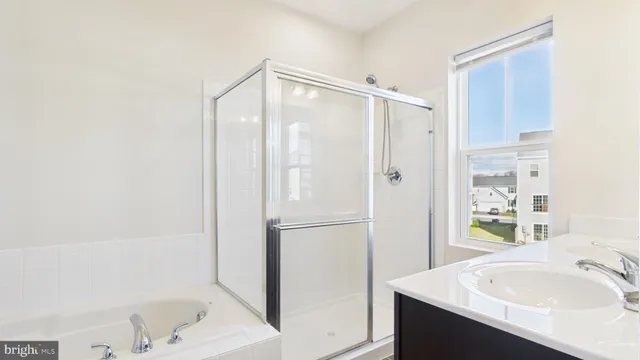 a white toilet sitting next to a shower