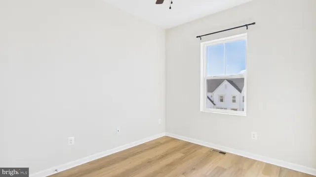 a view of a small space with wooden floor