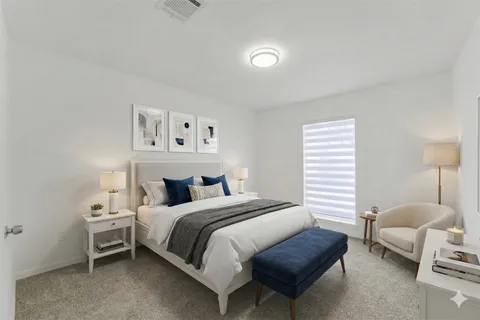 a view of a yard with plants and a barbeque