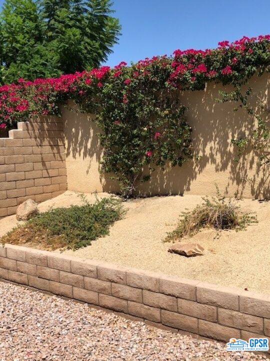 40 Shoreline Drive Rancho Mirage, CA 92270 - Photo 14 of 22 a view of a yard next to a house