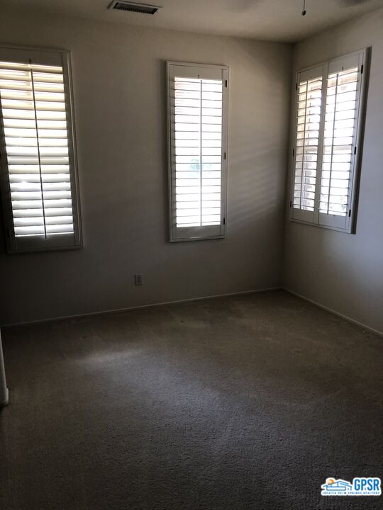 40 Shoreline Drive Rancho Mirage, CA 92270 - Photo 21 of 22 an empty room with a window
