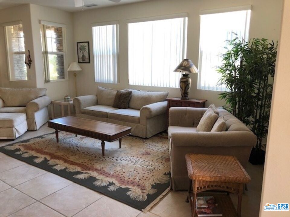 40 Shoreline Drive Rancho Mirage, CA 92270 - Photo 6 of 22 a living room with furniture and a potted plant
