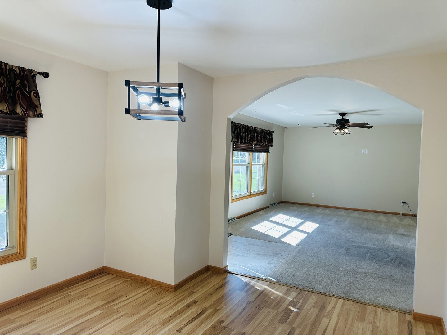 219 Palm Drive Lena, IL 61048 - Photo 12 of 50 a view of empty room with wooden floor and fan