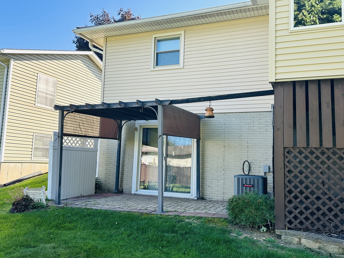 219 Palm Drive Lena, IL 61048 - Photo 47 of 50 a front view of a house with a yard