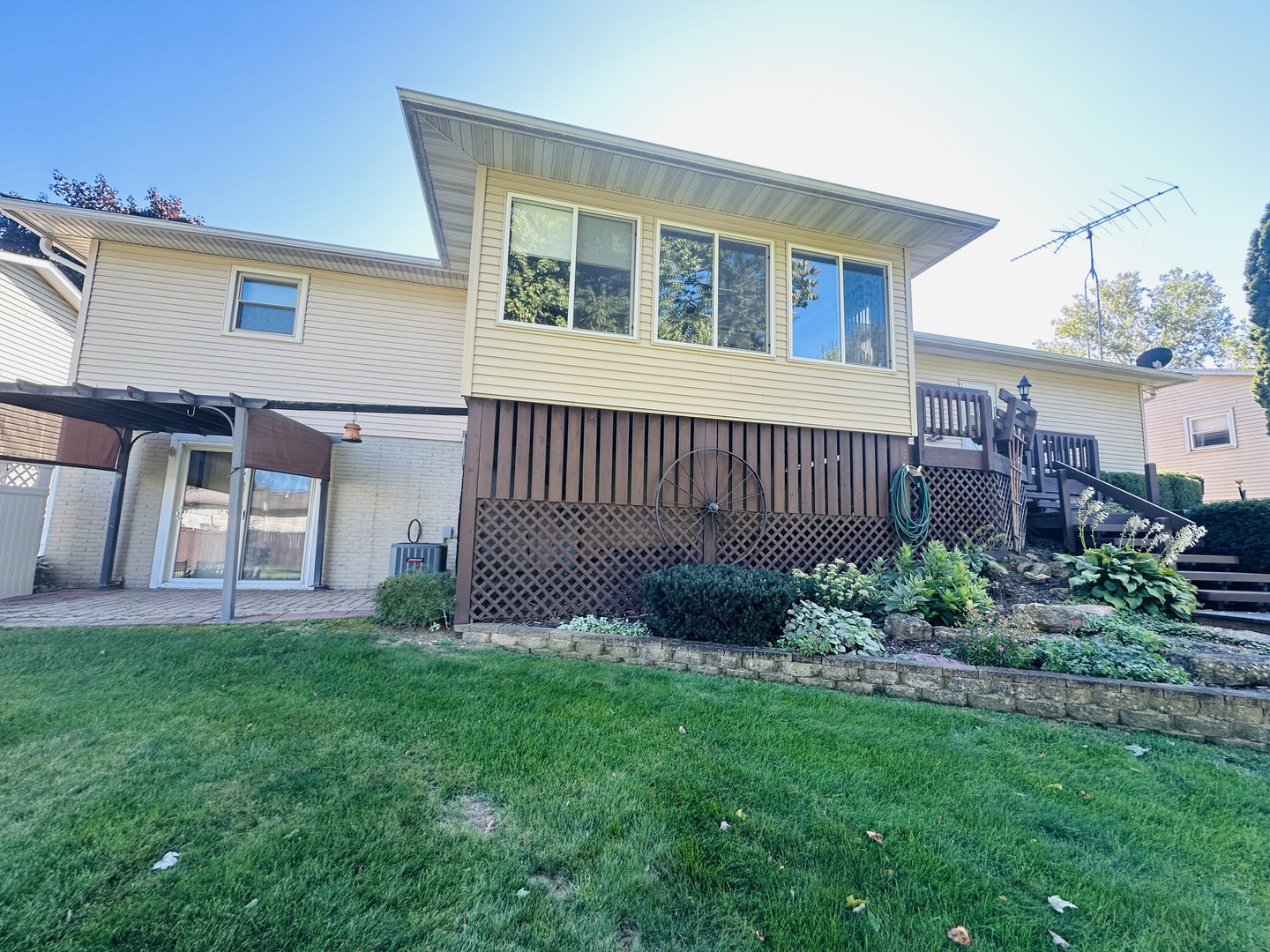 219 Palm Drive Lena, IL 61048 - Photo 48 of 50 a front view of a house with a garden and deck