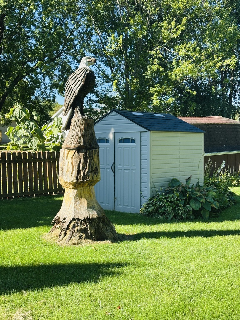 219 Palm Drive Lena, IL 61048 - Photo 50 of 50 a front view of a house with a garden and plants