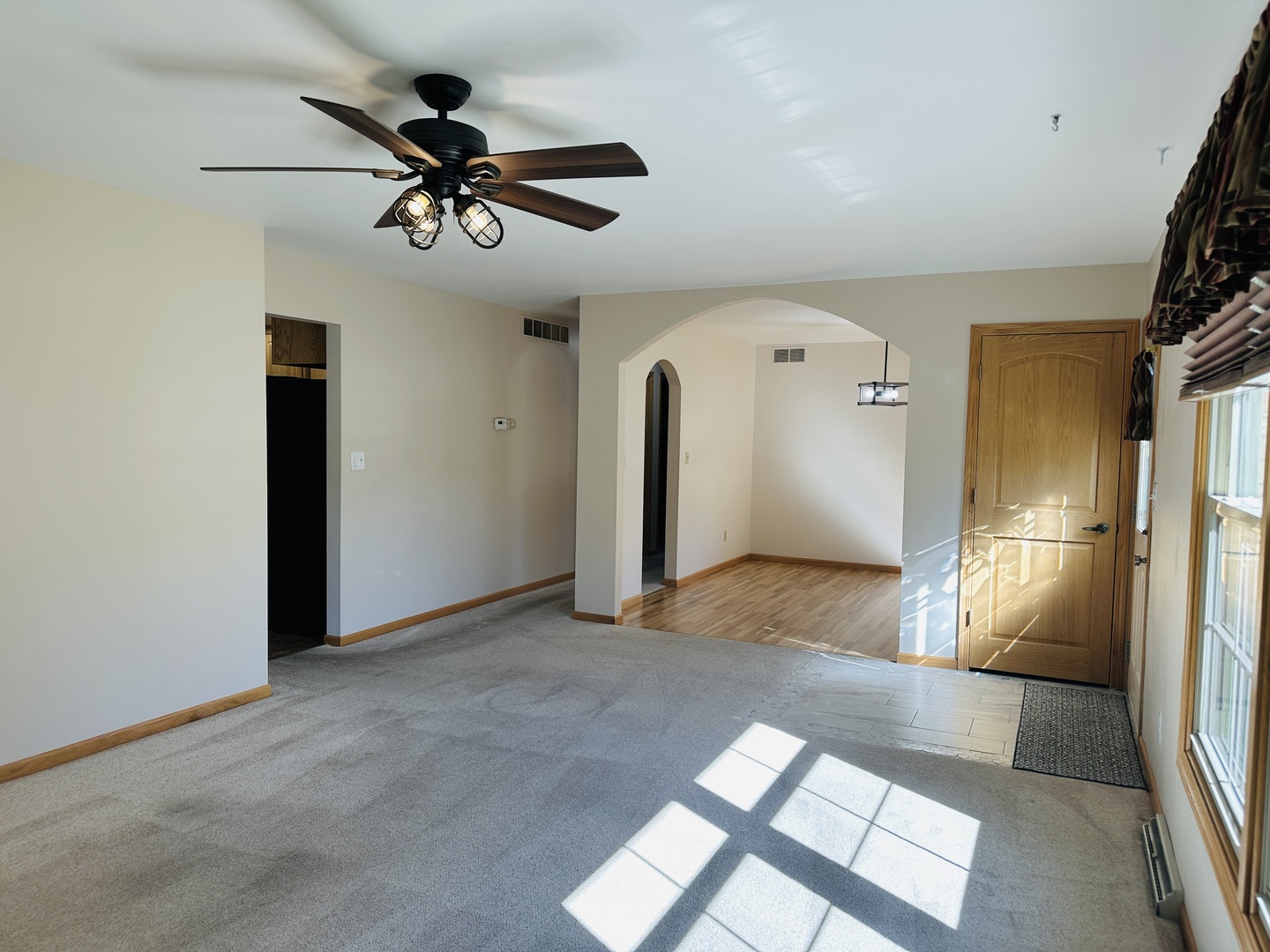 219 Palm Drive Lena, IL 61048 - Photo 6 of 50 a view of a livingroom with a ceiling fan and window