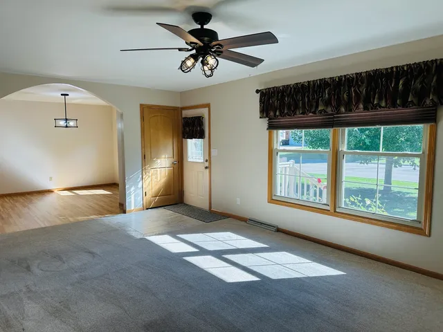a view of an empty room with a window