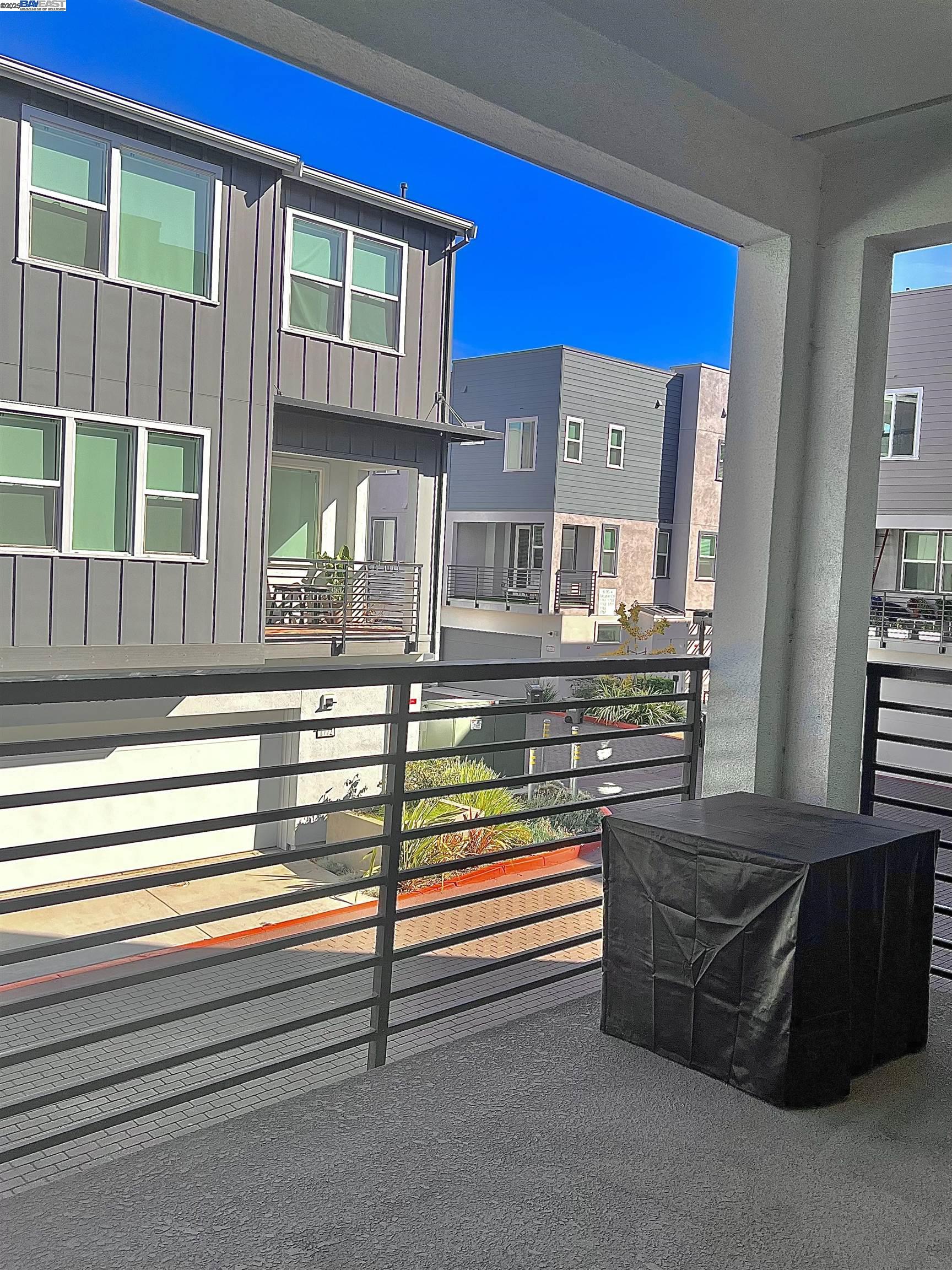 1712 17th Street Oakland, CA 94607 - Photo 16 of 31 a living room with furniture and windows