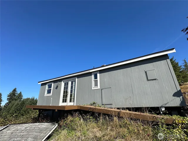 a bathroom with a granite countertop toilet sink and shower