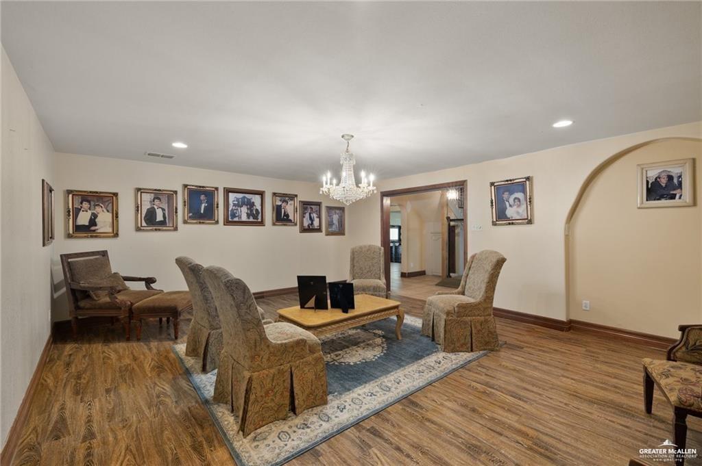 4523 South Tower Road Edinburg, TX 78542 - Photo 9 of 32 a living room with furniture and a wooden floor