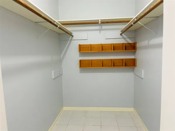 an empty room with wooden floor
