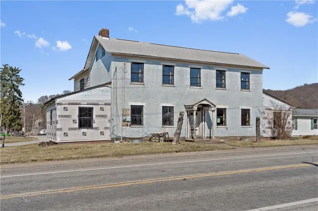a view of a house with a street