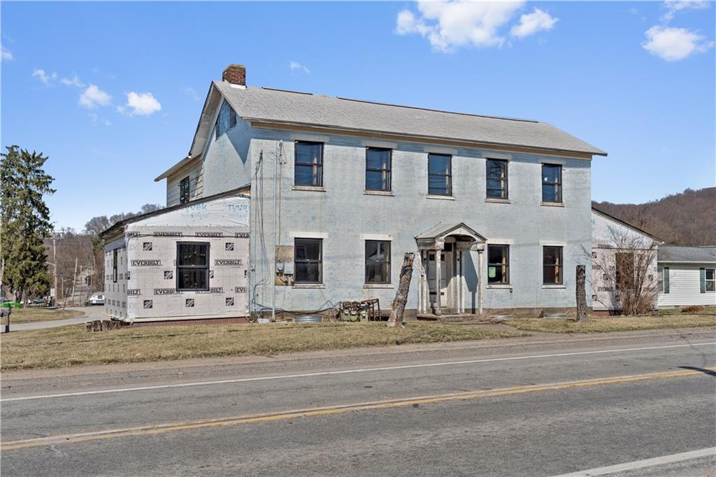 a view of a house with a street