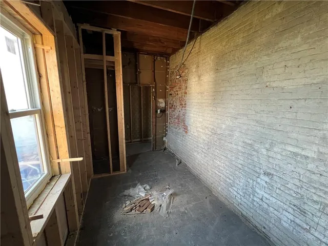 a view of an empty room with a fireplace