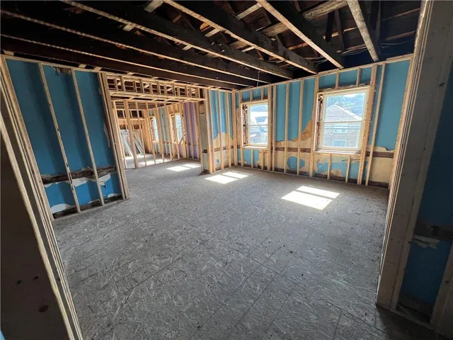 a view of an empty room with wooden walls